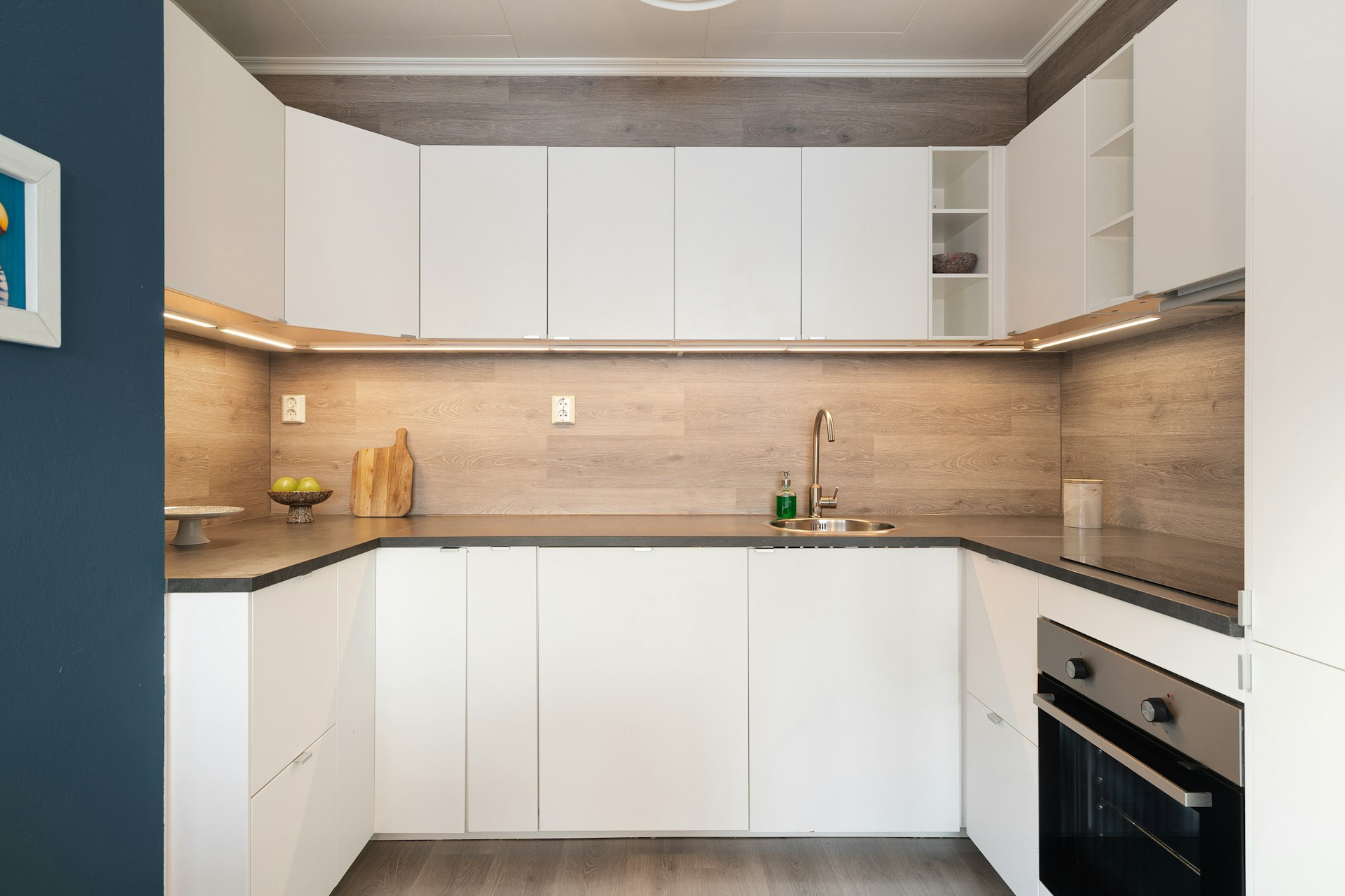 A kitchen with a stove top oven sitting inside of it